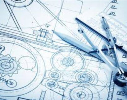 A picture of a blueprint with tools on it.