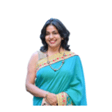 A woman in a blue sari smiling, featured in an issue of STEM Magazine.