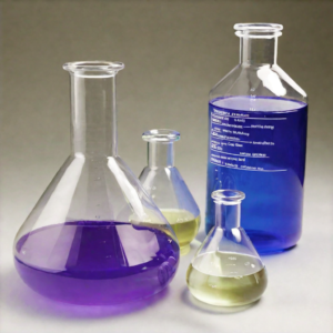 Three glass flasks with blue and purple liquids.